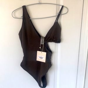 one piece bathing suit with cut out side. Brown w/small light brown polka dots.